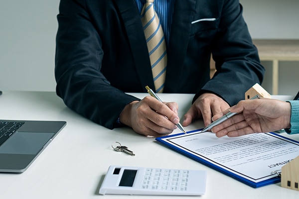 Real estate professionals and clients discussing home purchases,