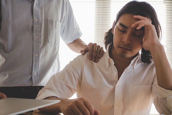 Comforting. asian business man upset about life problems with su